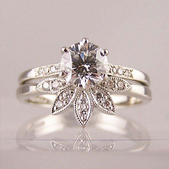 Diamond solitaire with shaped leaf tiara ring