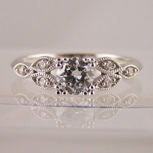 Diamond engagement ring with diamond set leaf shoulders, Claw Set Diamond Engagement Rings
