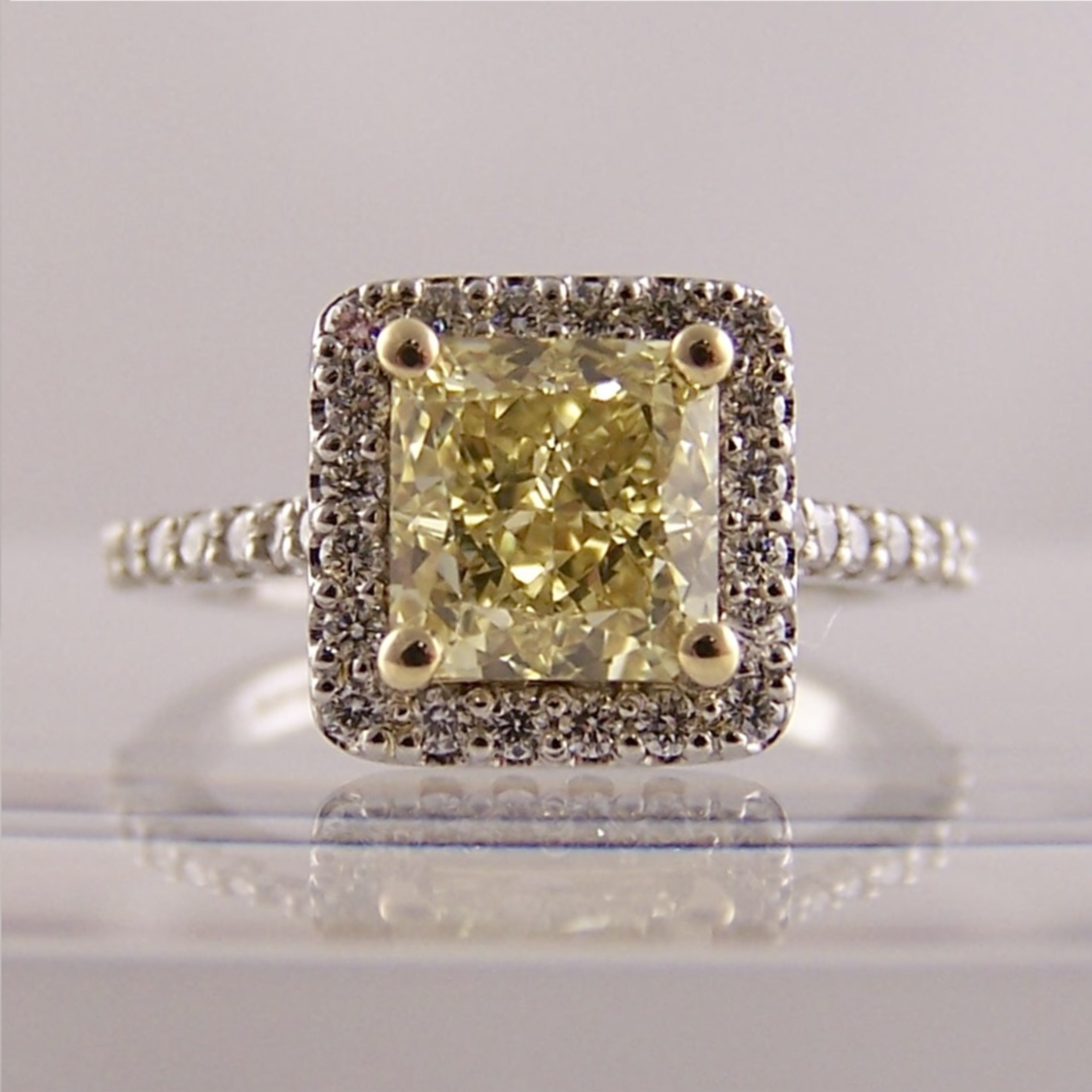 Yellow Diamond pendant reset into halo ring AFTER